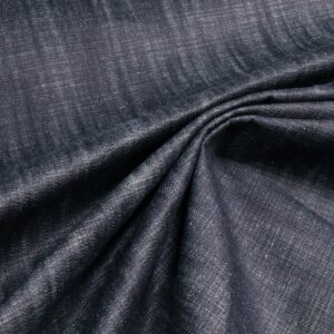 Denim di cotone blu indaco, tessuto drappeggiato a pieghe morbide